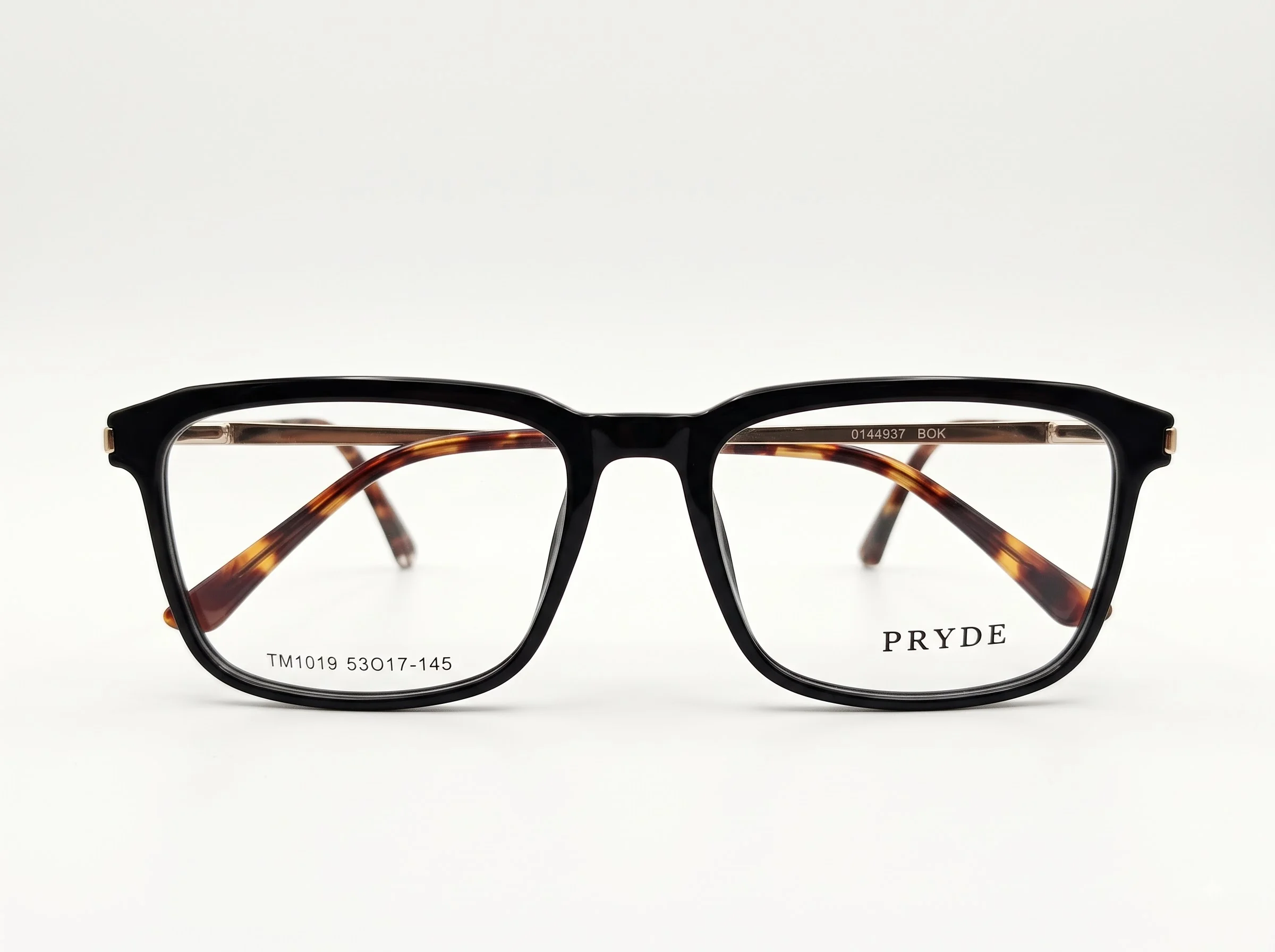 PRYDE FORME BLACK — polished black rectangular optical frame with tortoise wire-core temples, front view on white background.